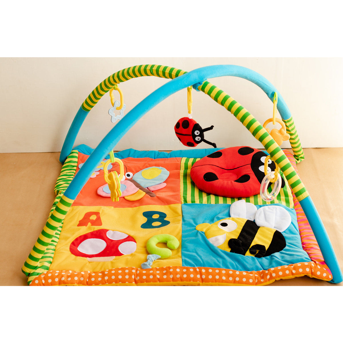 Baby mat with toys above new arrivals